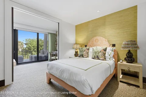 a bedroom with a bed and a large closet