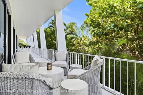 a view of balcony with furniture