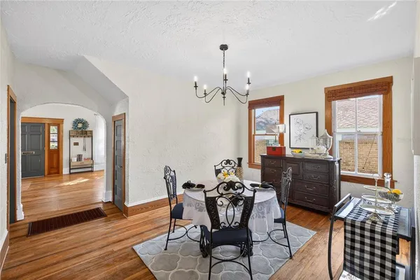 a view of a livingroom with furniture window and wooden floor