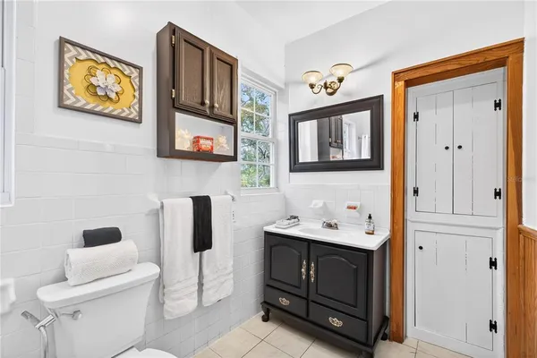 a bathroom with a sink a mirror and a toilet