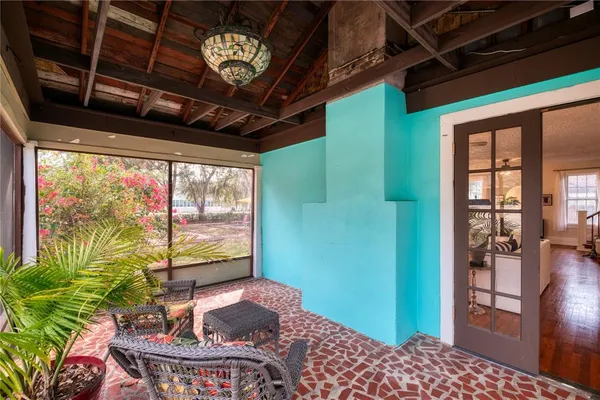 a livingroom with furniture and a potted plant