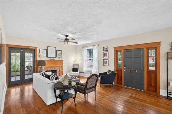 a living room with furniture and a fireplace