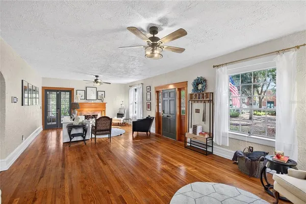 a work room with furniture and wooden floor