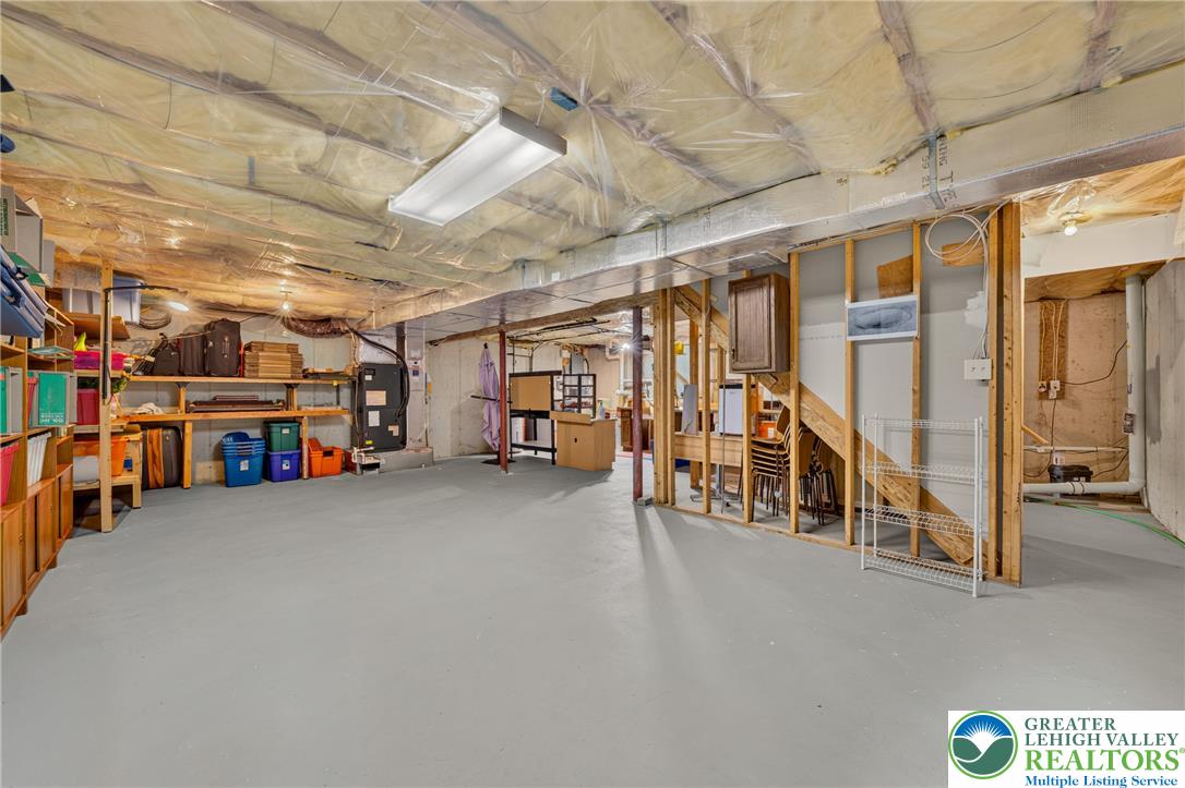 1702 Red Bud Road Quakertown, PA 18951 - Photo 54 of 68 A spacious unfinished basement presents a blank canvas for future customization and additional living space.