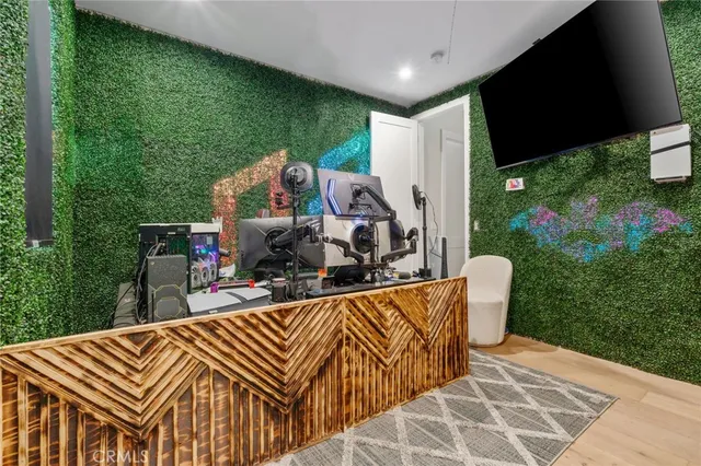 a view of a patio with table and chairs potted plants with floor to ceiling window