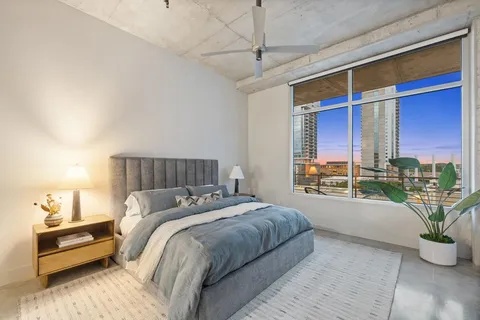 a bed room with a bed and a couch