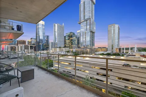 a view of city with tall buildings