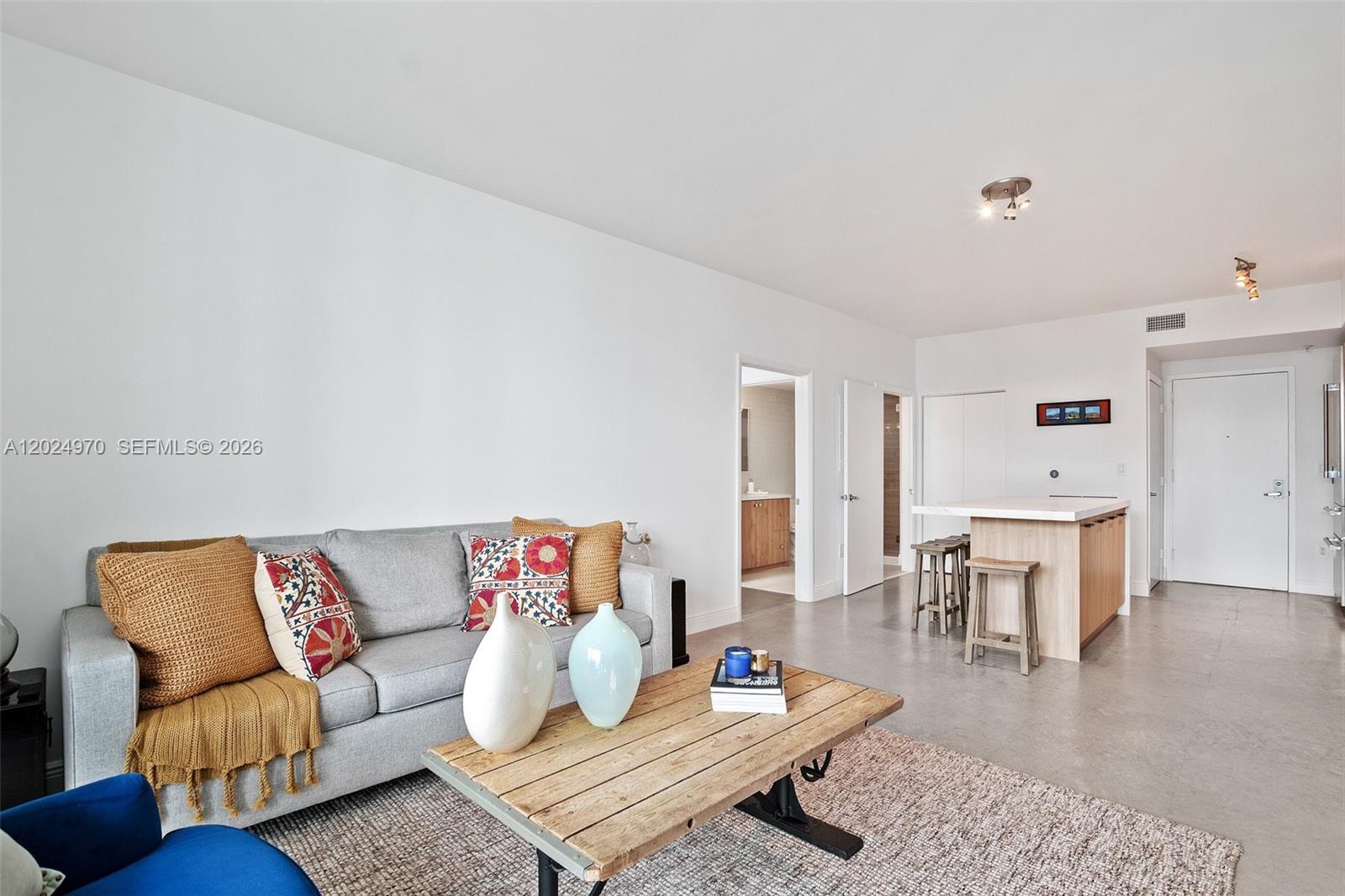 90 Southwest 3rd Street, Unit 3810 Miami, FL 33130 - Photo 14 of 45 a living room with furniture and wooden floor