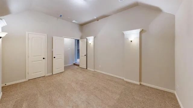 a view of empty room with ceiling fan