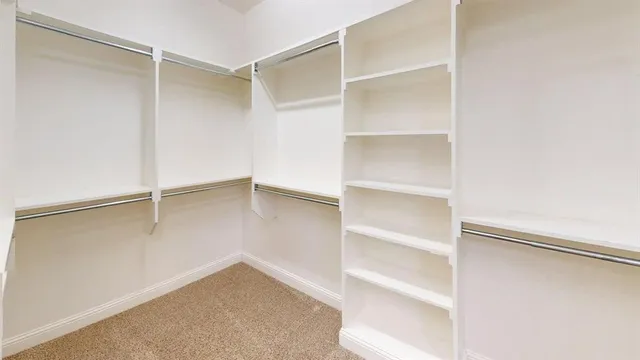 a view of house with garden space and swimming pool