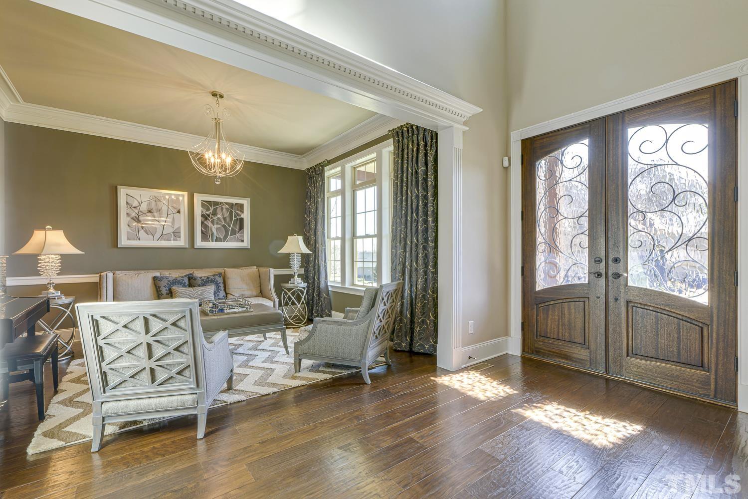 1013 Keith Road Wake Forest, NC 27587 - Photo 5 of 44 Magnificent foyer leads your guest to the impressive living room with custom molding.