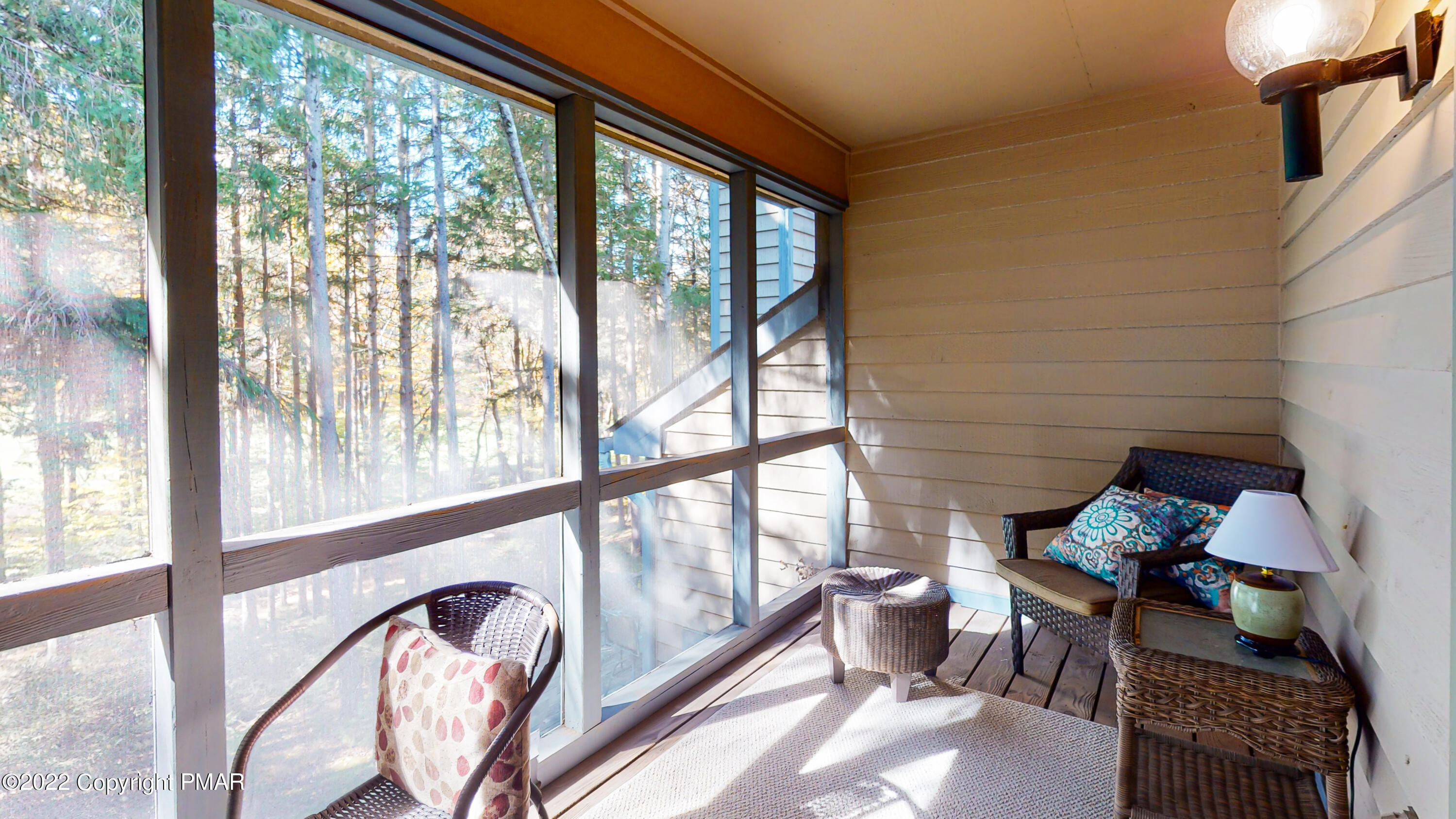 2169 Oak Hill Drive Canadensis, PA 18325 - Photo 13 of 40 a living room with furniture and floor to ceiling windows