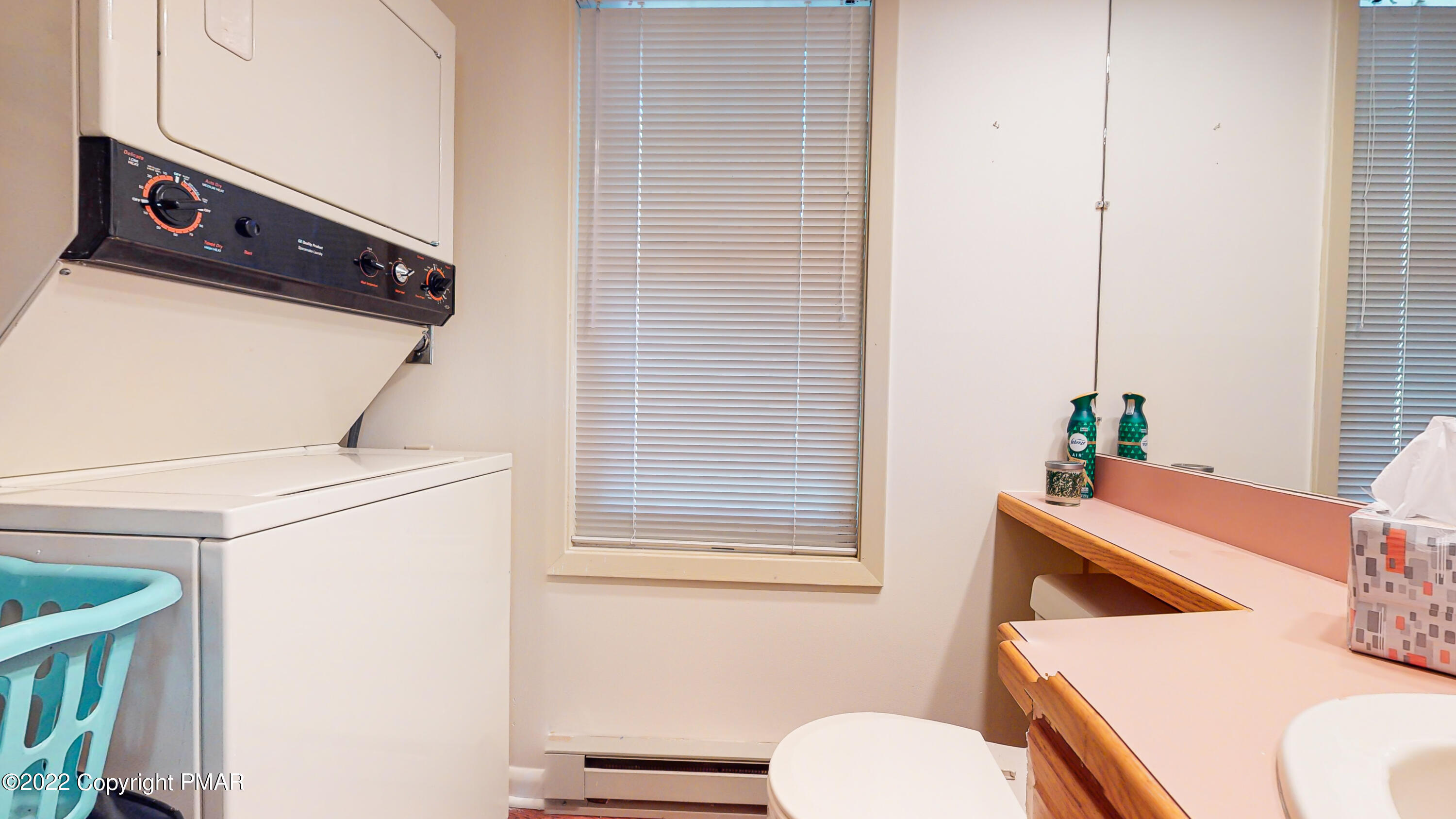 2169 Oak Hill Drive Canadensis, PA 18325 - Photo 15 of 40 a bathroom with a toilet a sink and a mirror