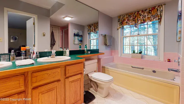 a bathroom with a sink a toilet and bathtub