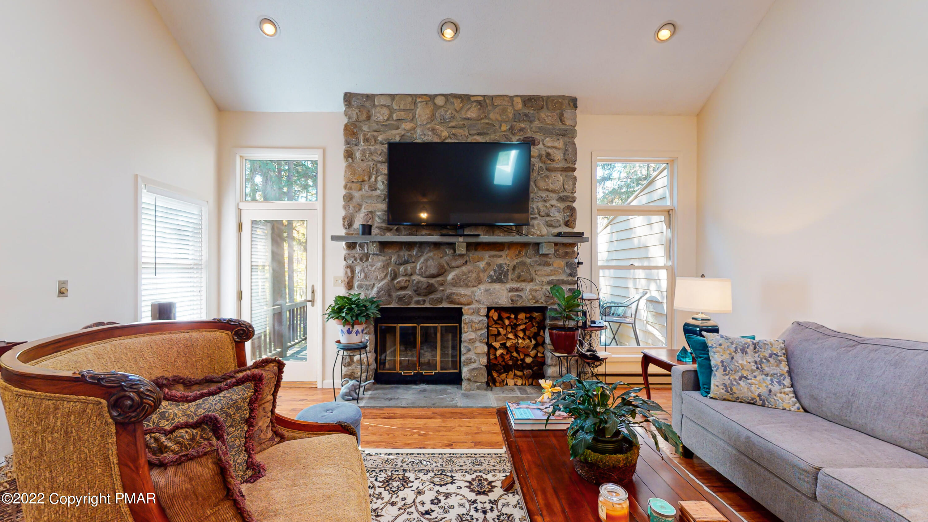 2169 Oak Hill Drive Canadensis, PA 18325 - Photo 3 of 40 a living room with furniture a flat screen tv and a fireplace