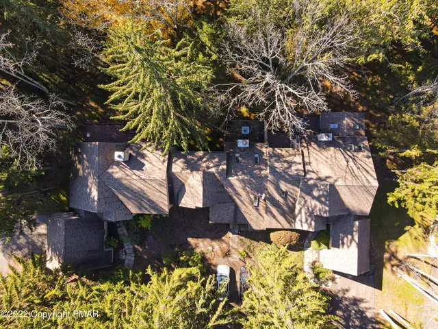 an aerial view of residential houses with outdoor space