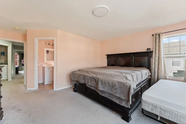 a bedroom with a bed and closet