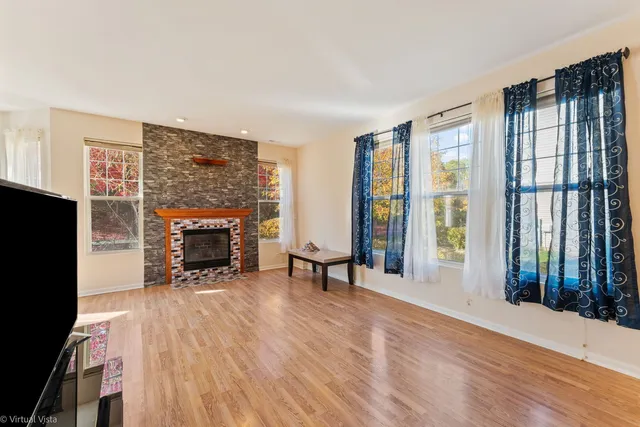 a view of a livingroom with furniture and a fireplace