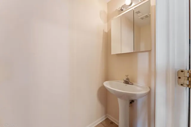 a bathroom with a sink and mirror