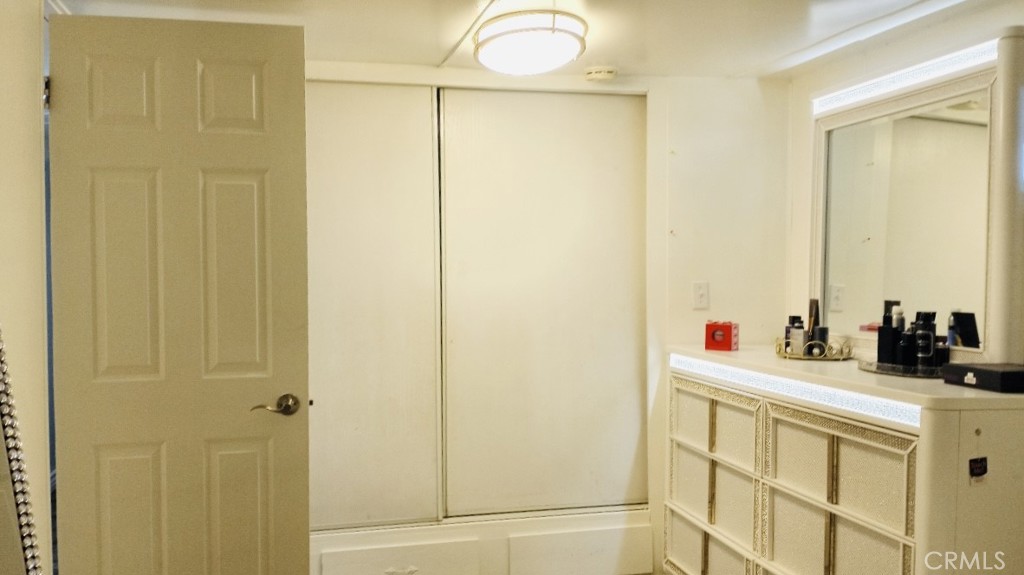 26250 9th Street, Unit 131 Highland, CA 92346 - Photo 14 of 15 a bathroom with a sink and a mirror