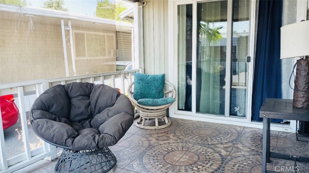 26250 9th Street, Unit 131 Highland, CA 92346 - Photo 15 of 15 a living room with furniture and a large window
