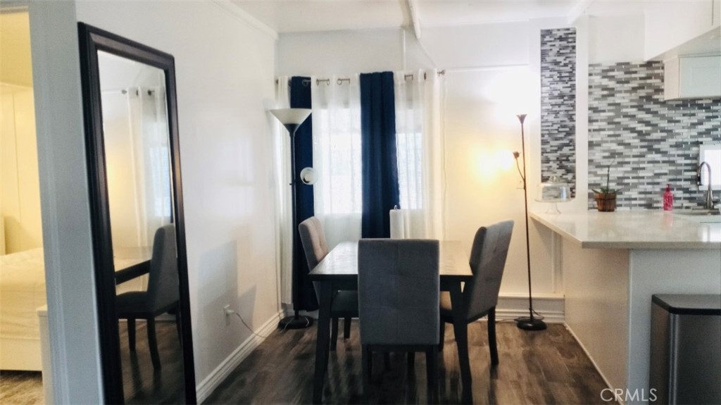 26250 9th Street, Unit 131 Highland, CA 92346 - Photo 3 of 15 a view of a dining room with furniture and a window