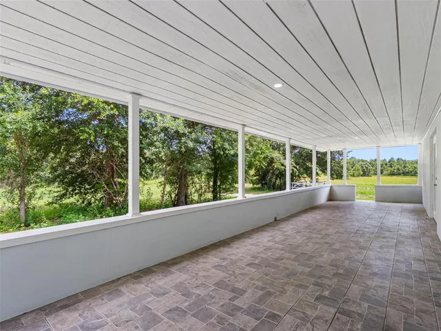 a view of a porch and garden