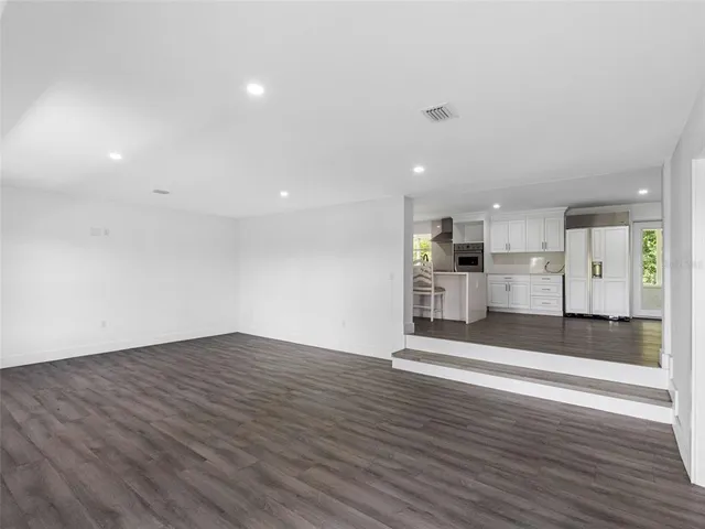 a view of kitchen with wooden floor
