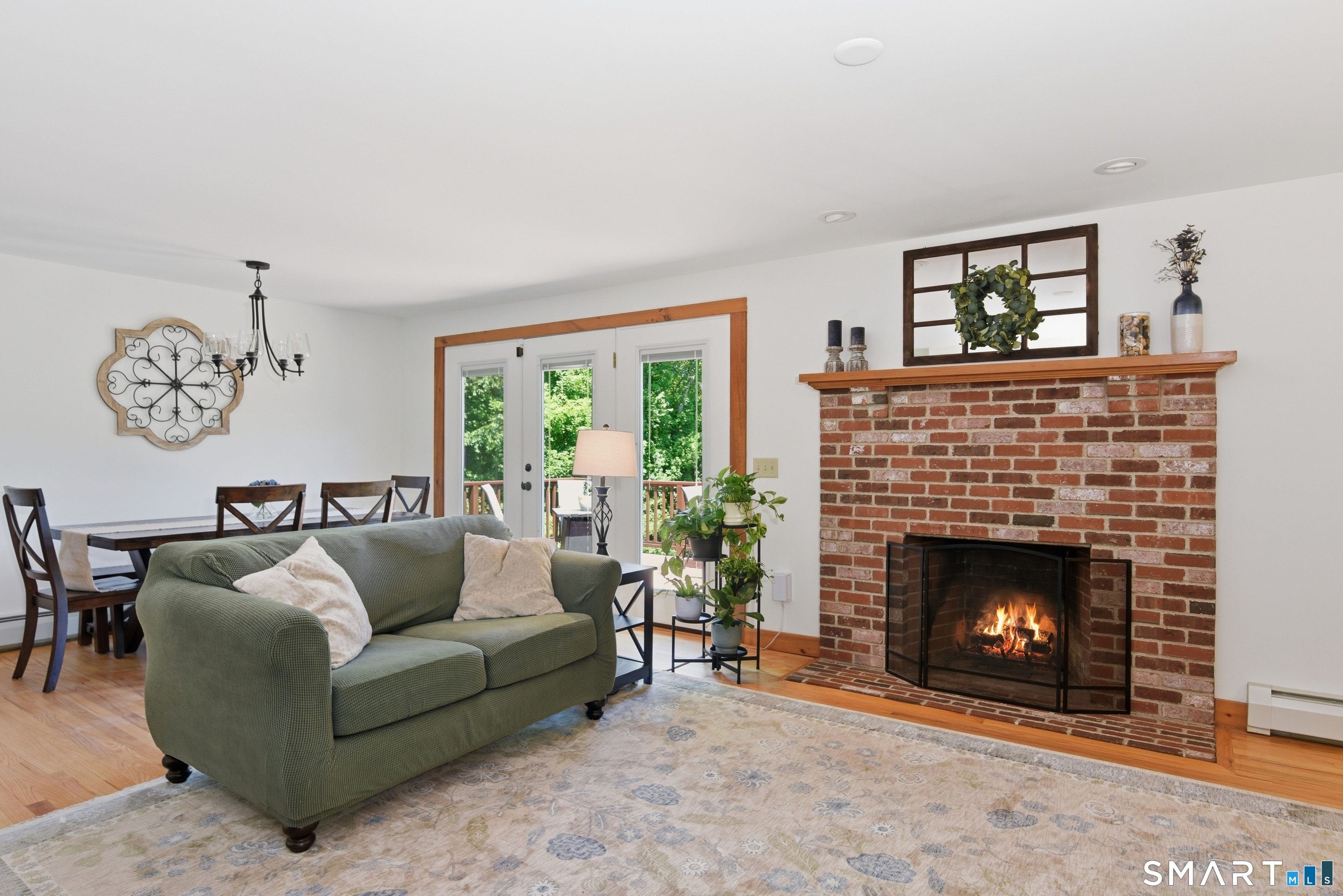 80 West Quasset Road Woodstock, CT 06281 - Photo 17 of 38 Spacious living room is anchored by a wood-burning fireplace and built-in shelves.