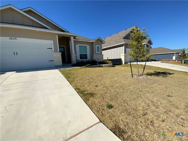 a view of backyard of a house