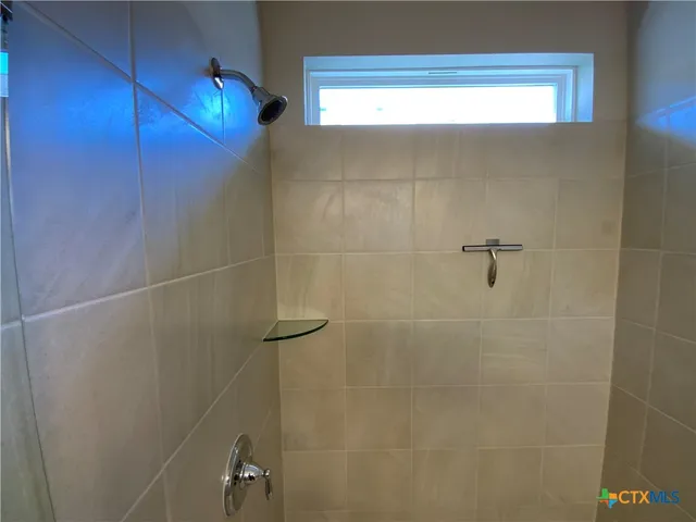 a close up view of an empty walk in closet