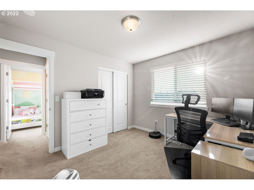 2620 South 12th Court Ridgefield, WA 98642 - Photo 16 of 20 a bedroom with a bed and furniture