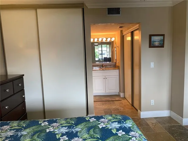 a view of a bathroom with mirror