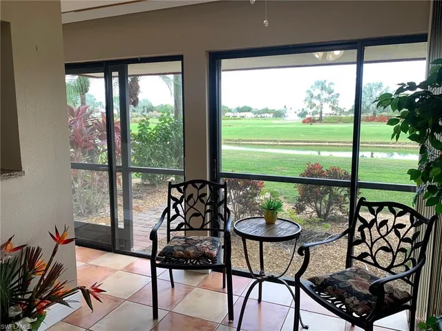 a view of a chairs and table in patio
