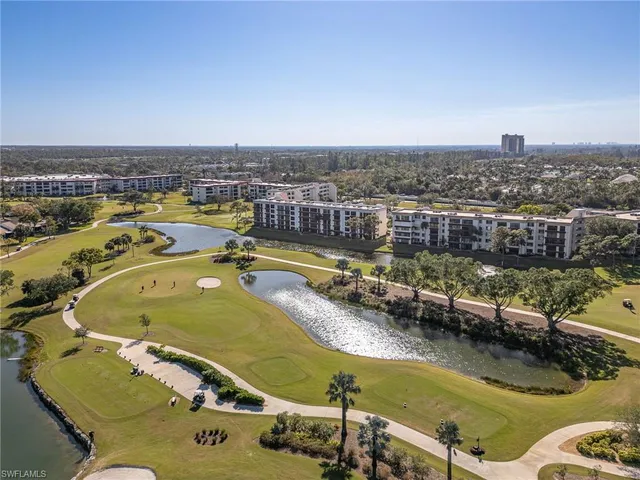 an aerial view of a house with a swimming pool