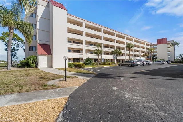 a city street lined with buildings and cars