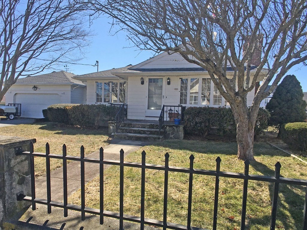 71 Kennedy Street Fall River, MA 02721 - Photo 1 of 28 a front view of a house with a yard