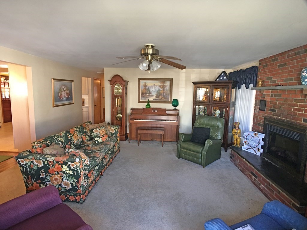 71 Kennedy Street Fall River, MA 02721 - Photo 12 of 28 a living room with furniture and a chandelier