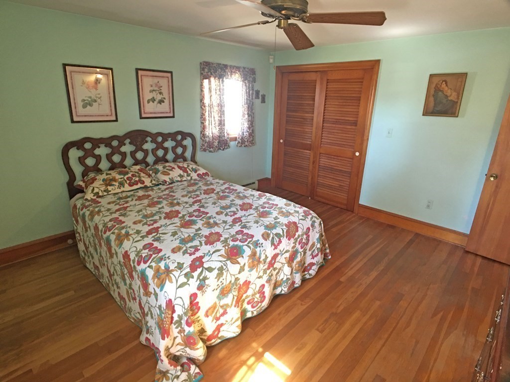 71 Kennedy Street Fall River, MA 02721 - Photo 17 of 28 a bed sitting in a bedroom next to a window