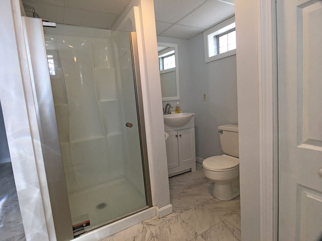 71 Kennedy Street Fall River, MA 02721 - Photo 19 of 28 a bathroom with a toilet and a shower