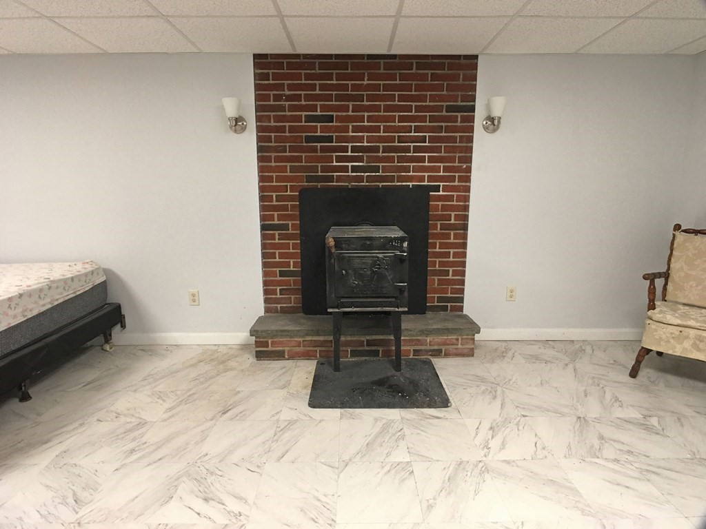 71 Kennedy Street Fall River, MA 02721 - Photo 22 of 28 a living room with a fireplace