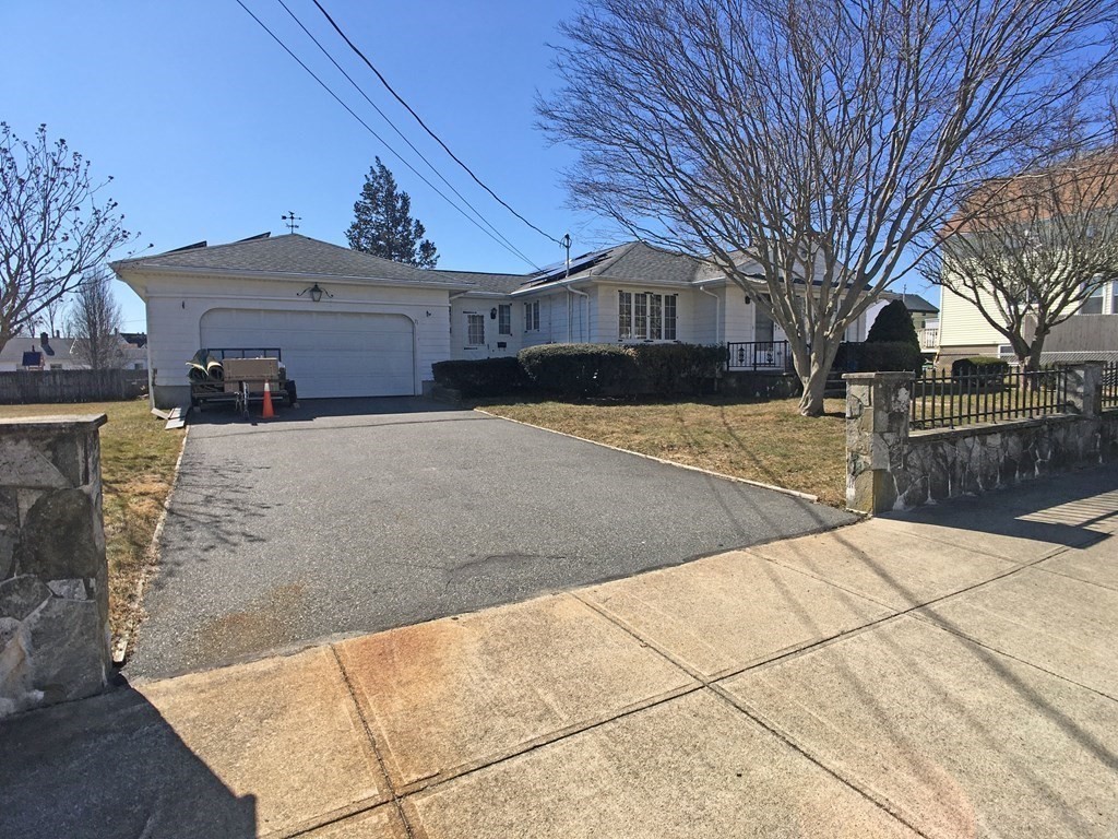 71 Kennedy Street Fall River, MA 02721 - Photo 3 of 28 a front view of a house with a yard