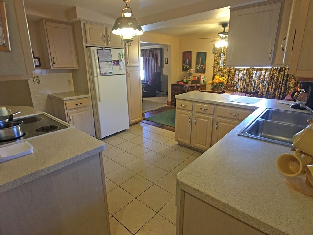 71 Kennedy Street Fall River, MA 02721 - Photo 9 of 28 a kitchen with a sink appliances and cabinets