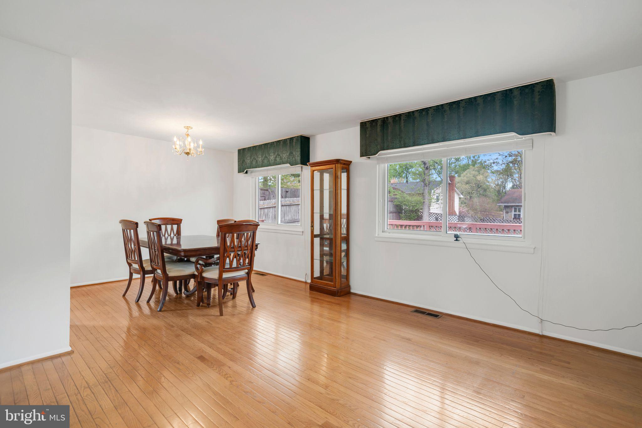 4552 Kinmount Road Lanham, MD 20706 - Photo 11 of 55 a view of a dining room with furniture window and wooden floor
