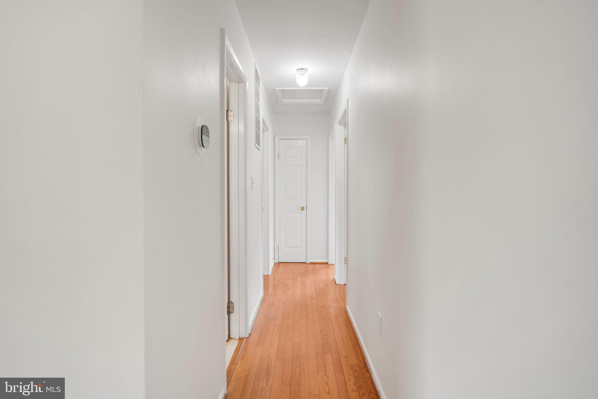 4552 Kinmount Road Lanham, MD 20706 - Photo 17 of 55 a view of a hallway with wooden floor