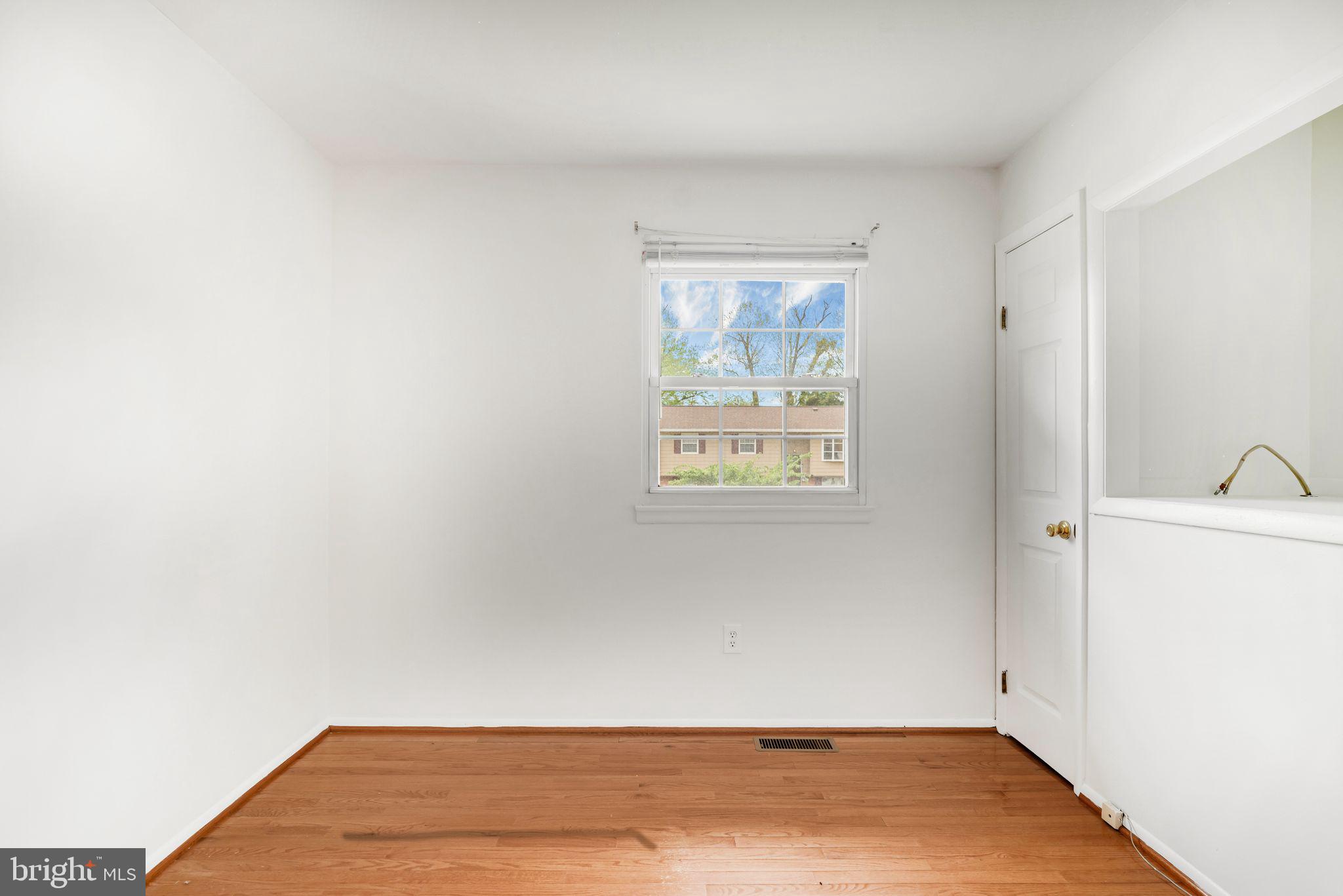 4552 Kinmount Road Lanham, MD 20706 - Photo 23 of 55 a view of an empty room with wooden floor