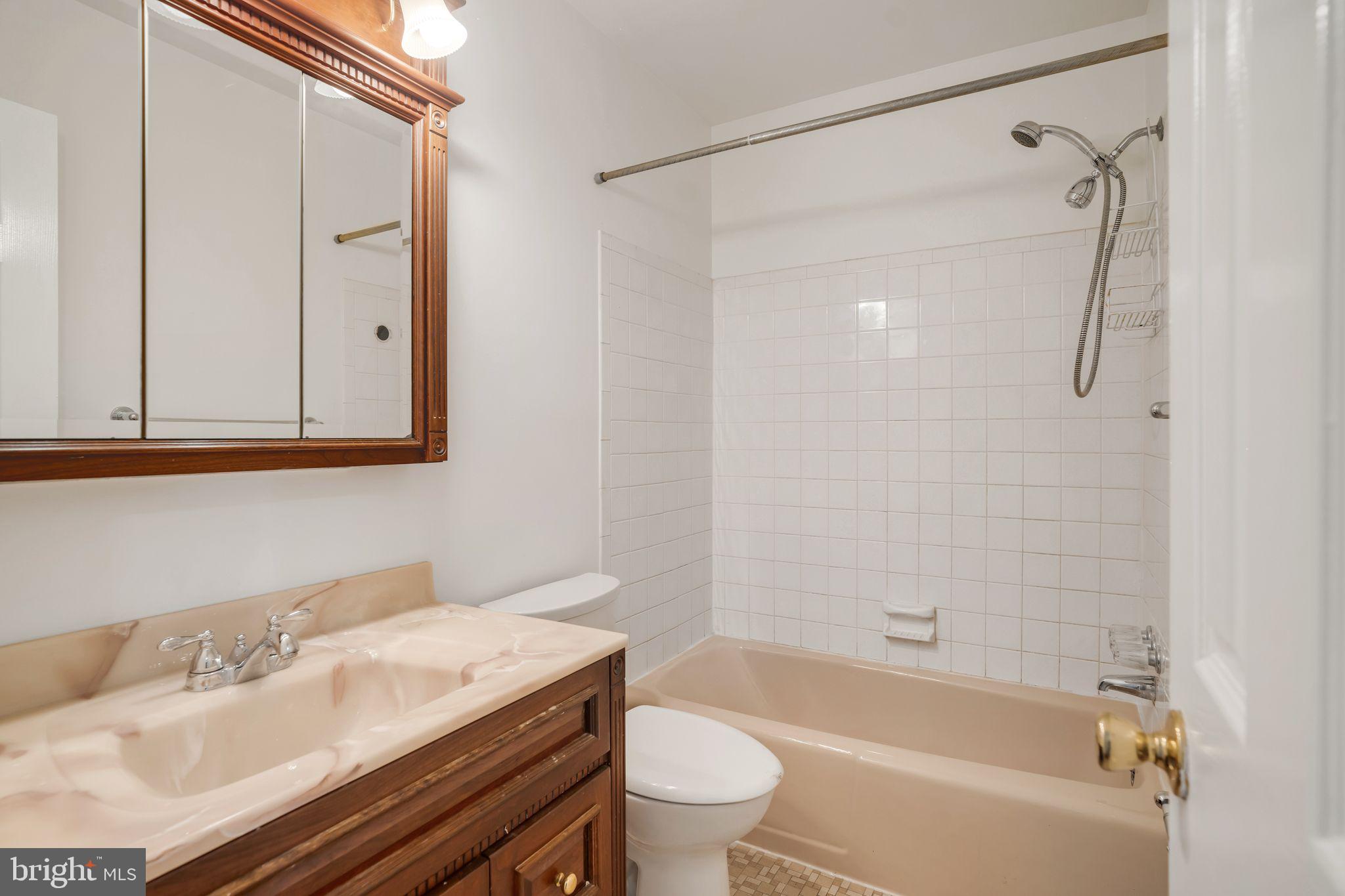 4552 Kinmount Road Lanham, MD 20706 - Photo 26 of 55 a bathroom with a granite countertop sink toilet and shower