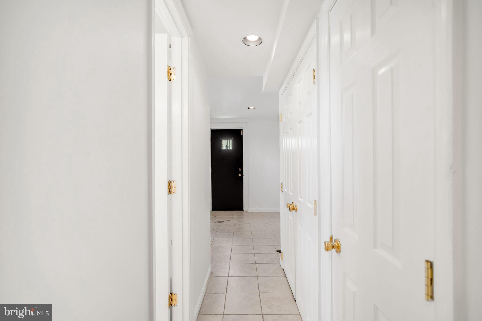 4552 Kinmount Road Lanham, MD 20706 - Photo 42 of 55 a view of a hallway with wooden floor and closet