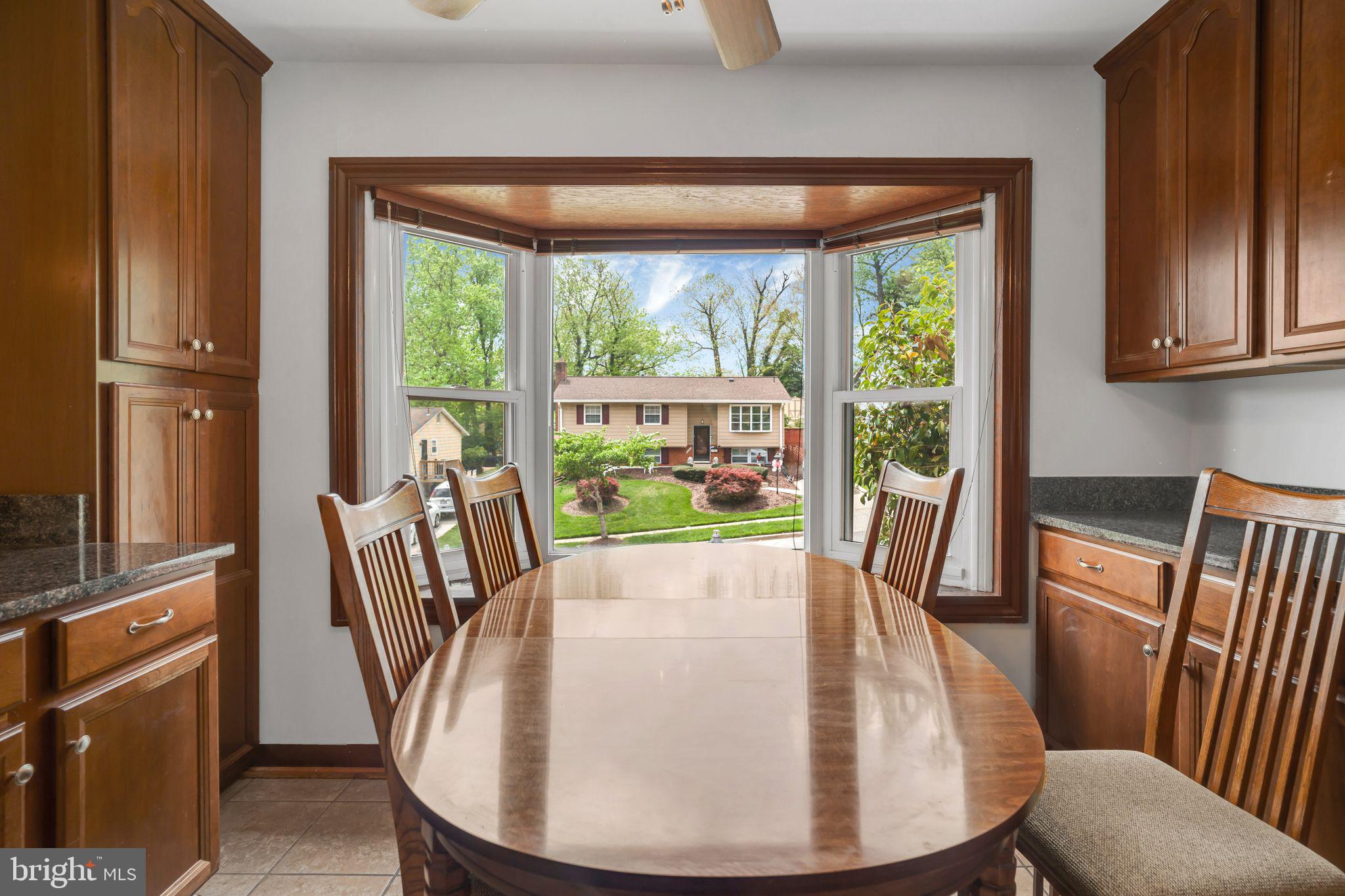 4552 Kinmount Road Lanham, MD 20706 - Photo 8 of 55 a view of a dining room with furniture window and wooden floor