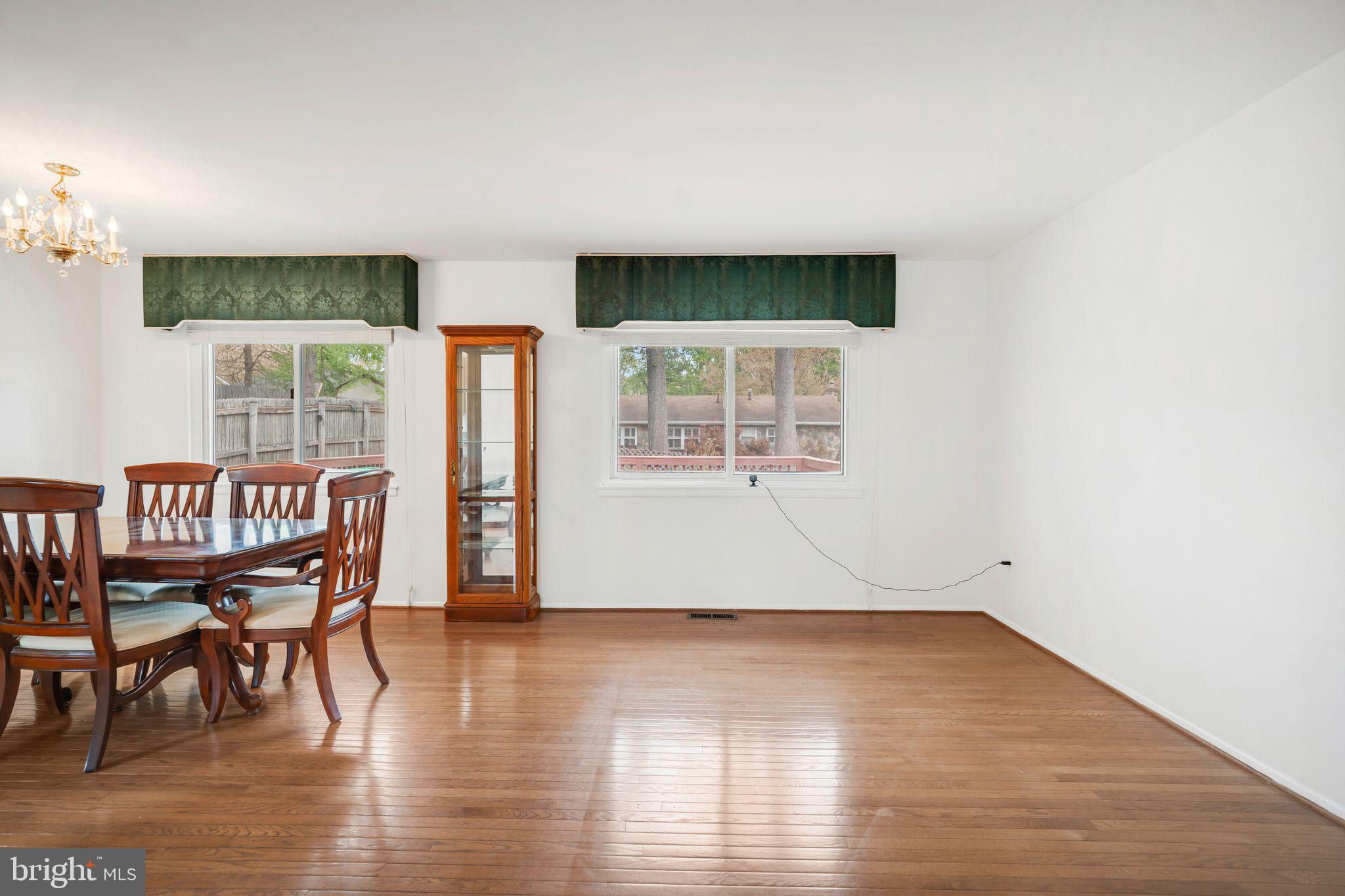 4552 Kinmount Road Lanham, MD 20706 - Photo 10 of 55 a view of a livingroom with furniture wooden floor and windows